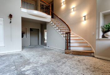 Staircase lights and floor being remodeled with red oak wood