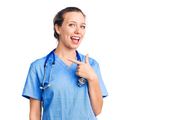 Young beautiful blonde woman wearing doctor uniform and stethoscope cheerful with a smile of face...