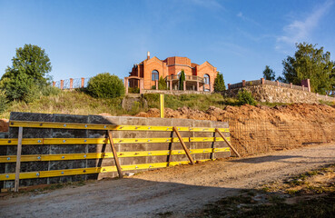 The construction of a retaining wall or counterfort, formwork, reinforced, preparation to pour...