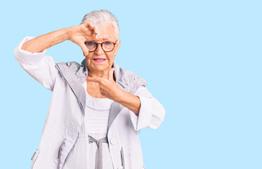 Senior beautiful woman with blue eyes and grey hair wearing casual clothes and glasses smiling making frame with hands and fingers with happy face. creativity and photography concept.