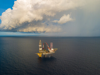 Aerial view from a drone of an offshore jack up rig at the offshore location during raining time...