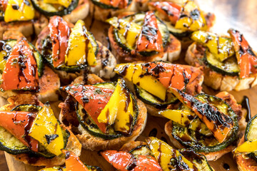 Grilled vegetables drizzled with sauce