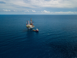 Aerial view from a drone of an offshore jack up rig at the offshore location during day time