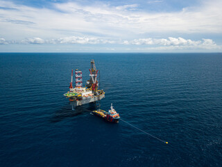 Aerial view from a drone of an offshore jack up rig at the offshore location during day time
