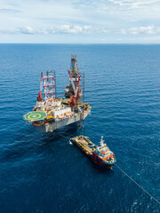Aerial view from a drone of an offshore jack up rig at the offshore location during day time