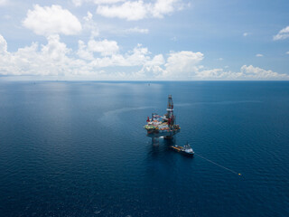 Aerial view from a drone of an offshore jack up rig at the offshore location during day time