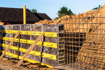 The construction of a retaining wall or counterfort, formwork, reinforced, preparation to pour...