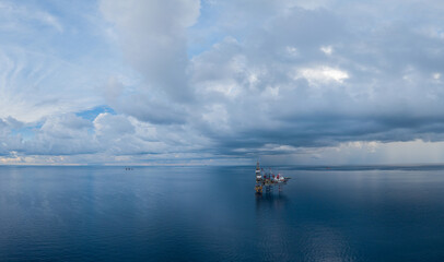 Fototapeta na wymiar Panoramic aerial view from a drone of an offshore jack up rig at the offshore location during day time