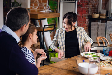 The mother is surprised with the present she just received from her family.
