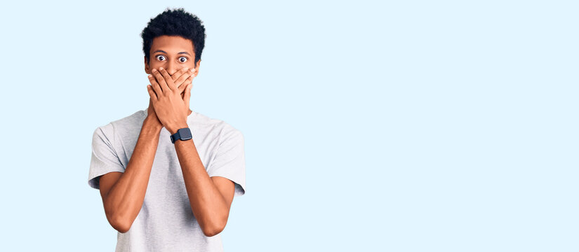 Young african american man wearing casual clothes shocked covering mouth with hands for mistake. secret concept.