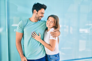 Young couple of boyfriend and girlfriend together hugging in love