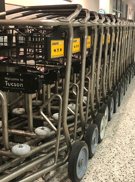 Luggage carts stacked together, unused in an empty Tucson International Airport in Arizona