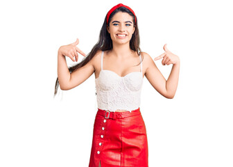 Brunette teenager girl wearing elegant look looking confident with smile on face, pointing oneself...