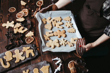 Woman with baked homemade gingerbread cookies