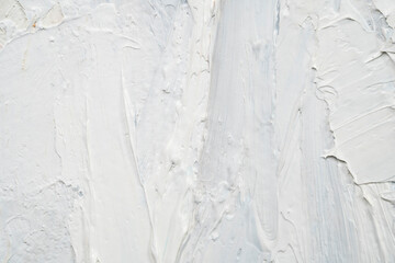 Macro. Abstract art. Expressive embossed pasty oil paints and reliefs. Colors: white. © Mariia