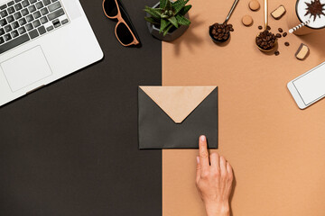 Obraz premium Workspace coffee design human hand point to envelop