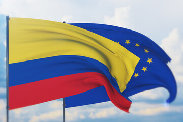 Waving European Union flag and flag of Colombia. Closeup view, 3D illustration.