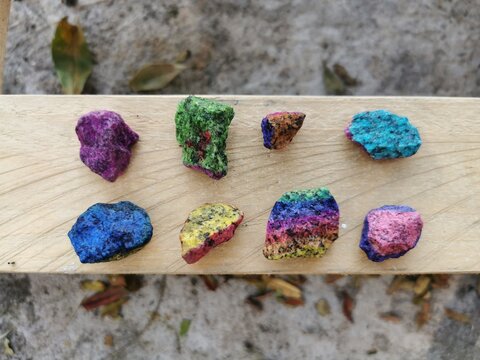 LGBT colors Painted Rock over wooden background