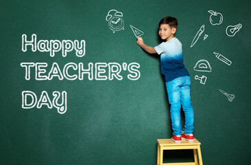 Cute little child drawing ruler near phrase Happy Teacher's Day on chalkboard