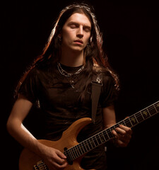 man playing electrical guitar