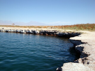 lake in south american atacama desert altiplano with mountains