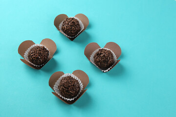 Brigadeiro, handmade chocolate candy on blue background