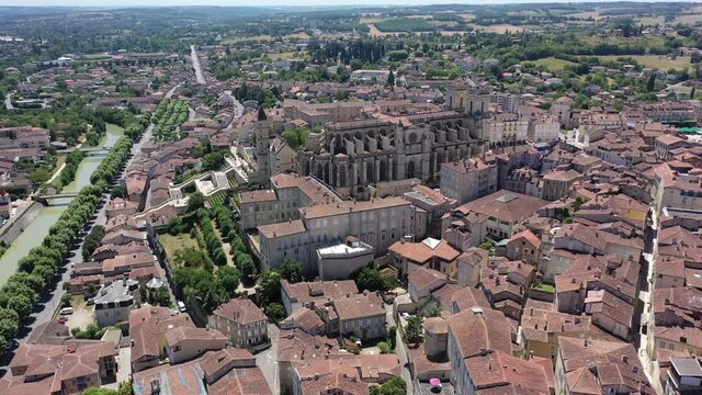 Aerial view of colorful Auch cityscape on Gers river with Sainte-Marie Cathedral and Tour d Armagnac on sunny summer day, France