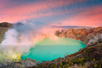 Panorama landscape view of Kawah Ijen at sunrise sky. The most famous tourist attraction in...