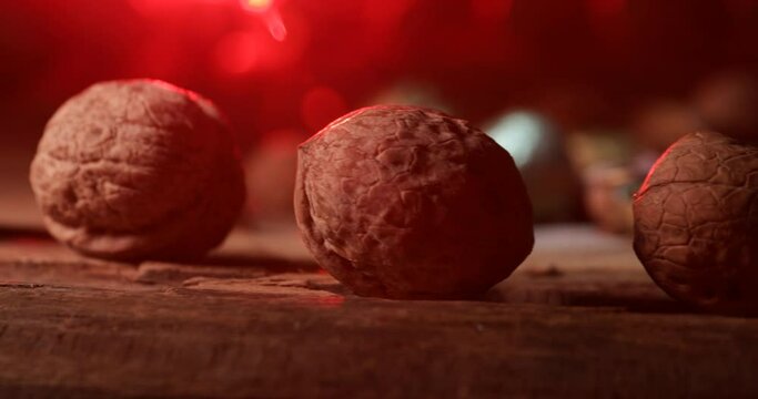 Nut meal concept. Walnuts rotating on wooden plate.  Selective focus