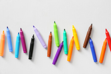 Colorful felt-tip pens on white background