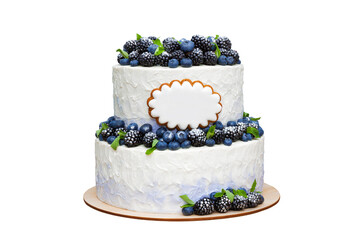 two tiered cake decorated with blueberries and blackberries