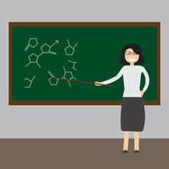 Happy Teacher's Day concept. Teacher points to the chemical symbols on the Board