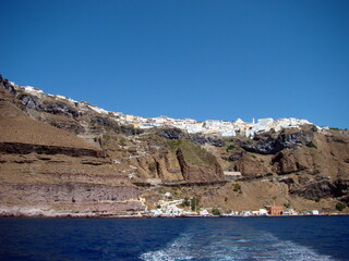Fototapeta na wymiar Santorini Greece, White Blue Buildings, Aegean Sea, Clear sky
