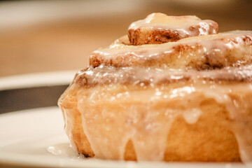 Delicious hot cinnamon roll with icing