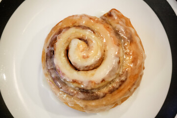Delicious hot cinnamon roll with icing