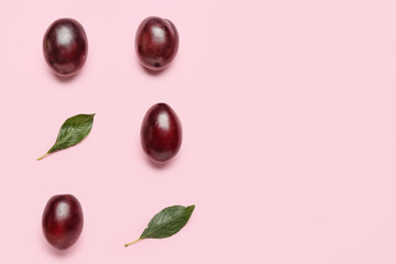 Tasty sweet plums on color background
