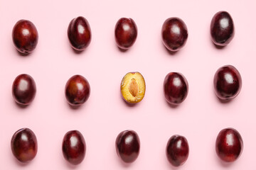 Tasty sweet plums on color background