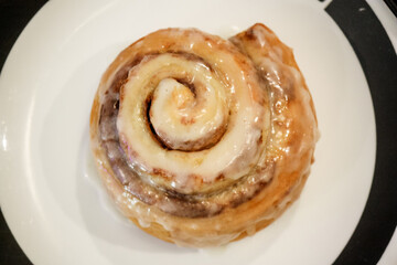 Delicious hot cinnamon roll with icing