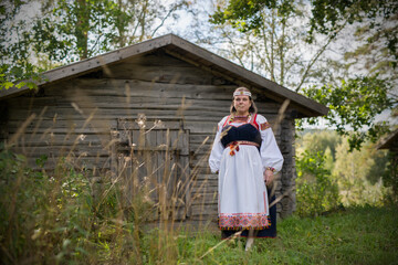 Woman wearing Finnish-Ingrian national costume, "tuuterinpuku" © Hannes