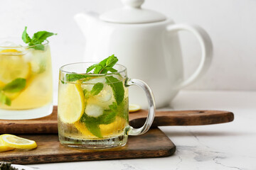 Cup of tasty cold ice tea on table