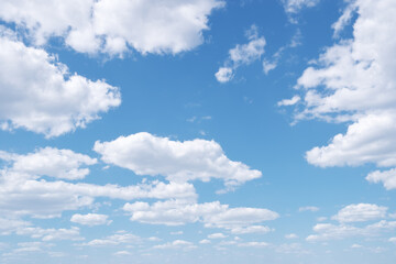 Naklejka na ściany i meble White clouds and deep blue sky at day.