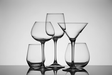 Empty glasses on grey background