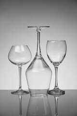 Empty glasses on grey background