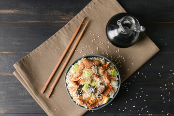 Bowl with tasty fried rice on table