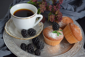 Muffins - delicious pastries. Delicious dessert on the table - homemade muffins. Portioned cupcakes. 
