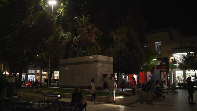 The atmosphere at night with people in the middle of the karditsa city.