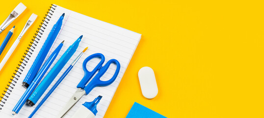 Savings. Laptop with headphones on white desk red coins bank and hand writing Distant learning or working from home, online courses, home finance concept. small business support or loans