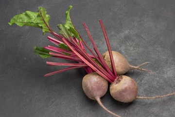 Fototapeta na wymiar Root vegetables of beets. Black background