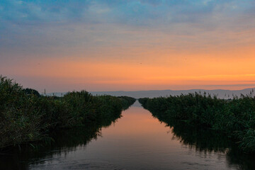 Plakat sunset colors with water canal 