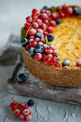Cheesecake cake with berries. Cake with delicate curd and dough base. High quality photo.